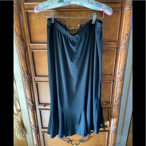 Ladies black skirt. Size 14. Elastic waist. Flare bottom. Washable!